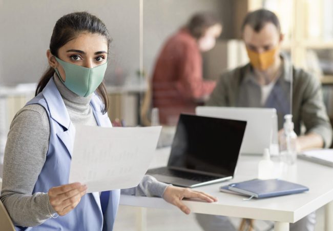 co-workers-wearing-face-mask-office co-workers-wearing-face-mask-office